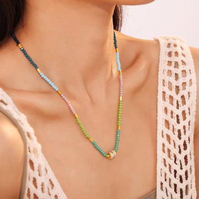 Colorful opal bead necklace with rhinestone barrel on model