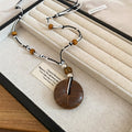 Black and Brown Cord Necklaces with Round Wood Look Pendants view 7