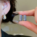 Silver Tone Crystal Handbag Drop Huggie Earrings with Detailed Finish view 2