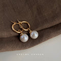 Gold Tone Round Hoop Earrings With Large White Pearl Drop Charms view 3