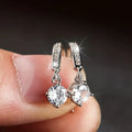 Round Clear Solitaire Bar Drop Earrings In Three Metal Tones view 2