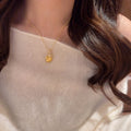 Gold Tone Textured Feather and Crystal Pendant Necklace view 4