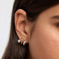 Double-Arc Clear Stone Stud Earrings In Polished Gold Tone view 3