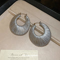Woven Open Circle Huggie Earrings In Eight Designs view 3