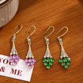 Gold Teardrop Crystal Drop Earrings Green and Purple view 1