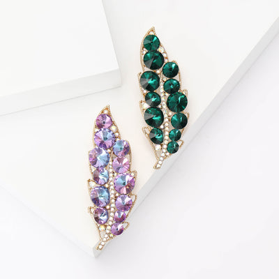 Front view of long tapered leaf set with crystals