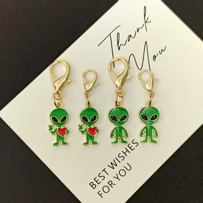 Four green alien lobster clasp keychains large and small sizes