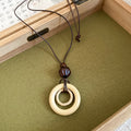 Black Cord Geometric Pendant Necklaces in Seven Designs view 10