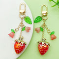 Strawberry Charm Keychains Featuring Red Strawberry Across 15 Pictured Variations view 1
