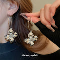 Crinkled Metal Flower Charm Hoop Earrings in Gold and Silver view 4