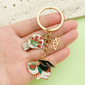 Graduation Charm Keychains Featuring Red Book Across 31 Pictured Variations view 3