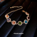 Gold Tone Bracelet With Seven Multicolor Round Crystal Halo Links view 2