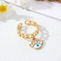 Gold Tone Curb Chain Crystal Evil Eye and Hamsa Charm Rings view 8