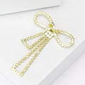 Long Crystal Bow Brooch in Silver and Gold Tone Decorative Lapel Accessory view 3