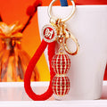 Jeweled Money Peanut Keychains in Red and Yellow with Two Wrist Loop Options view 1