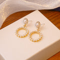 White Pearl Look Open Circle Gold Tone Stud Earrings view 2