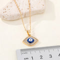 Gold Tone Crystal Outline Blue Evil Eye Pendant Necklace view 2