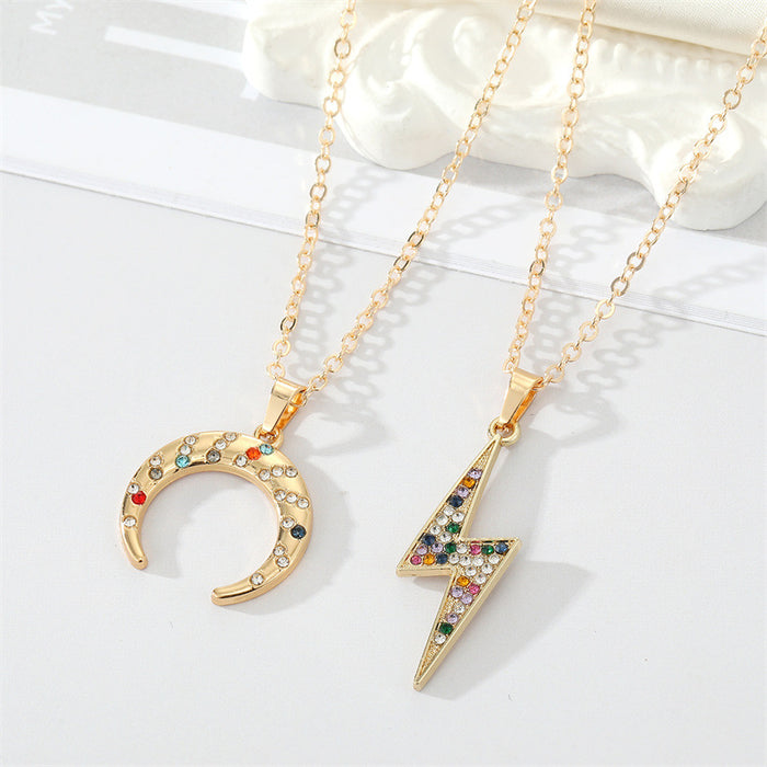 Gold Tone Multicolor Crystal Lightning and Crescent Horn Necklaces