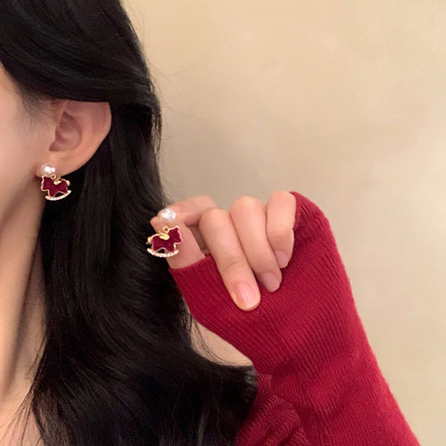 Product image 2 showing assorted red horse themed studs with pearl, crystal and metal accents