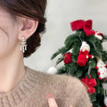 Star Bow Tassel Stud Earrings In Gold And Silver With Decorative Metal Details view 2