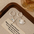 Mismatched Starfish and Scallop Shell Silver Huggie Earrings view 4