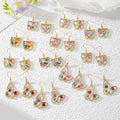 Gold Tone Pressed Flower Butterfly Drop Earrings in Twelve Designs view 1