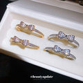 Small Crystal Bow Hoop Earrings in Gold and Silver Tone view 3