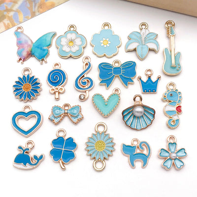 Colorful crown and heart charms arranged on a light background