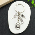 Antique Silver Cowboy Hat Boot and Pistol Keychain Set view 4