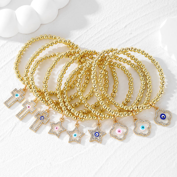 Gold Tone Beaded Crystal Evil Eye Flower Star and Cross Bracelets