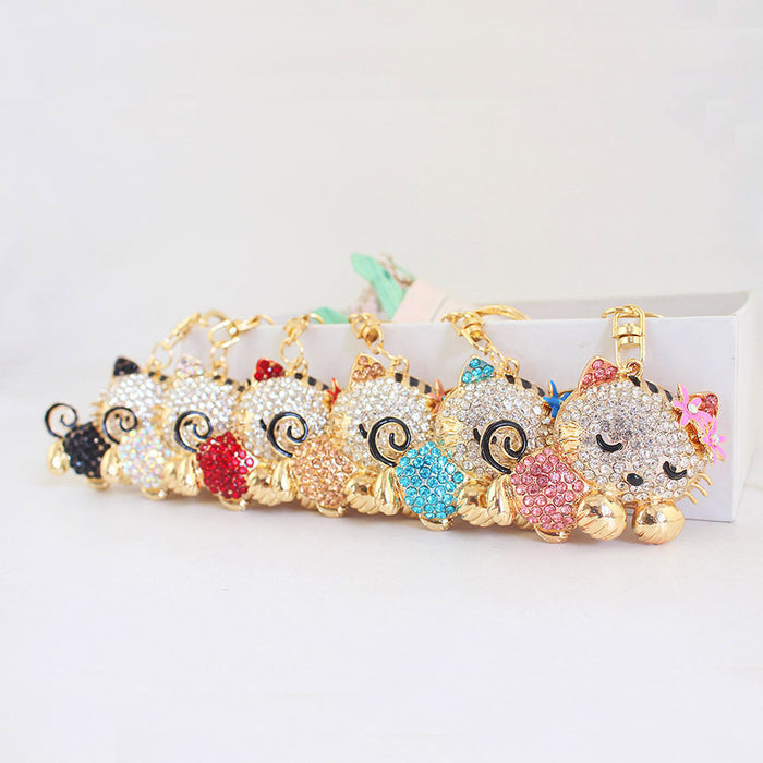 Rhinestone Sleeping Cat Keychain With Flower Accents And Clasp