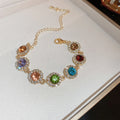 Gold Tone Bracelet With Seven Multicolor Round Crystal Halo Links view 6