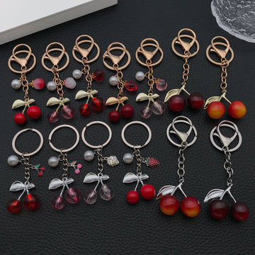 Twelve Resin Cherry Strawberry and Peach Metal Keychain Designs