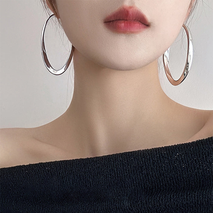 Polished Elongated Oval Hoop Earrings in Gold and Silver