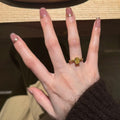 Gold Tone Yellow Oval Center Ring Baguette Side Accents view 2