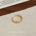Gold Open Adjustable Ring Smooth Band Pinch Detail view 4