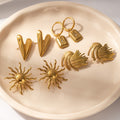 Gold Tone Feather Stud And Star Plaque Huggie Earrings view 1