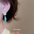 Blue Beaded Geometric Drop Earrings with Polished Metal Details view 3