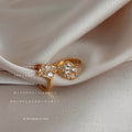 Gold Tone Crystal Fan Huggie Earrings Baguette Leaf Design view 4