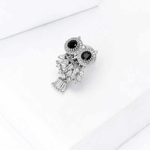 Angled close-up showing crystals on the black eye crystal owl brooch