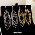 Nested Oval Wire Drop Hook Earrings In Gold And Silver view 1