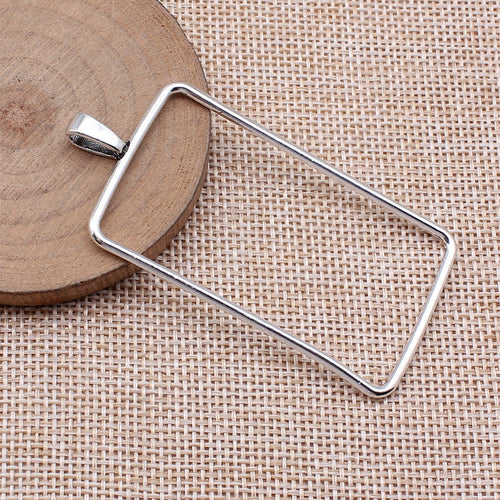 Large Rectangle Open Frame Pendant in Silver Tone Metal shown in image 2, highlighting a large open rectangle, slender m