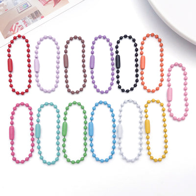 Colorful jewelry chain jewelry findings arranged on a light background