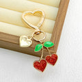 Gold Heart Clasp Charm Keychain With Bow Cherry Accent view 4