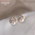 Gold Tone Open Teardrop Frame White Pearl Stud Earrings view 1