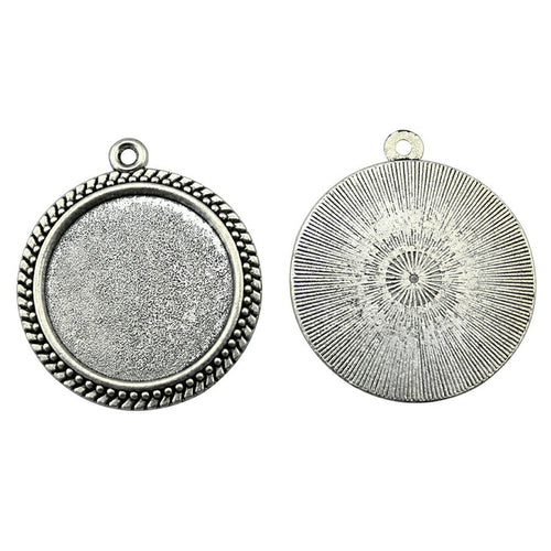 Styled view of braided-rim round bezel pendant trays in two finishes