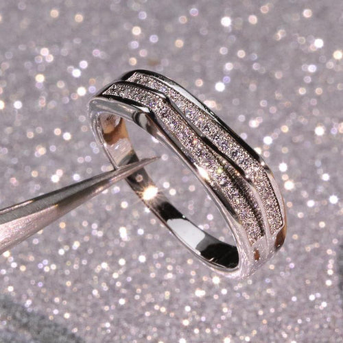 Product view showing silver-tone offset double-row pave band ring