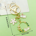 Cat Charm Keychains Featuring White Flower Across 19 Pictured Variations view 3
