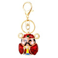 Jeweled Wealth Figure Keychains with Faux Fur Poms in Four Pictured Colors view 5