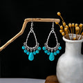 Thirty-Eight Silver Tone Turquoise Look Ethnic Earrings view 1